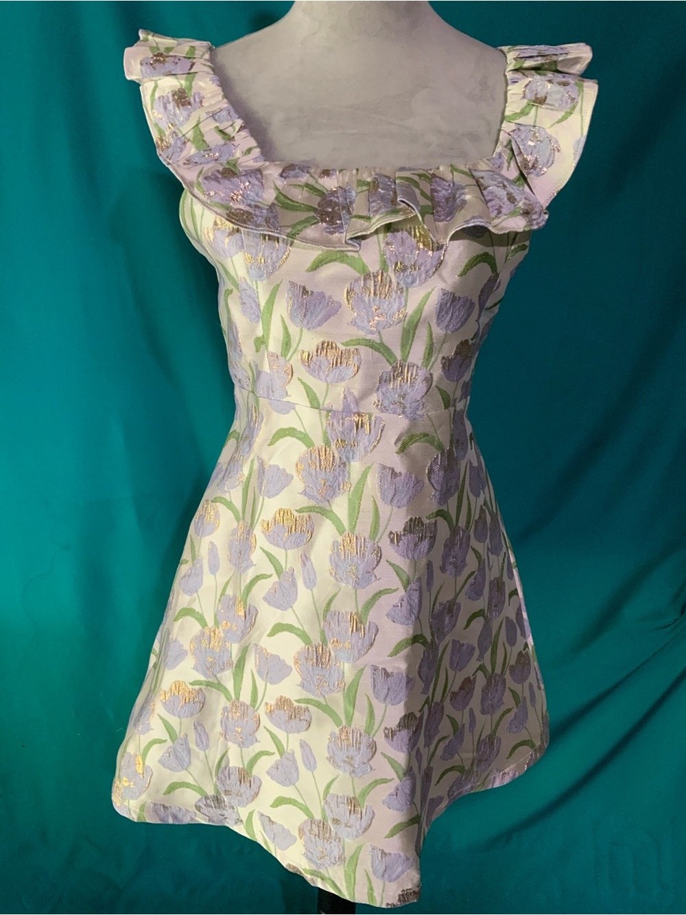 B. Right LAVENDER AND GREEN FLORAL JACQUARD DRESS W/SILVER PALETTE, GOLD ACCENTS